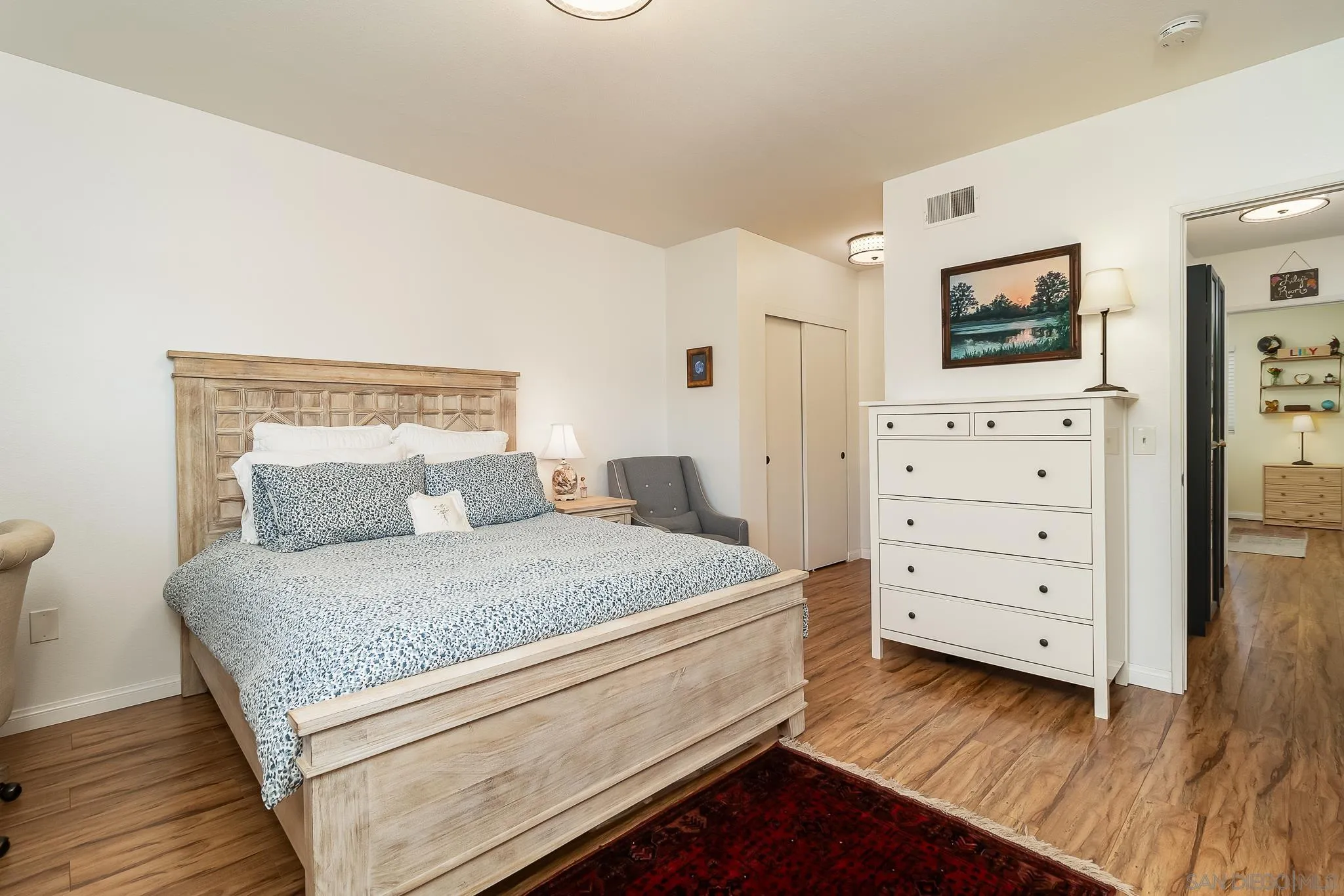 350 G Street, Unit E2 Chula Vista, CA 91910 - Photo 10 of 30 a bedroom with a bed and a dresser