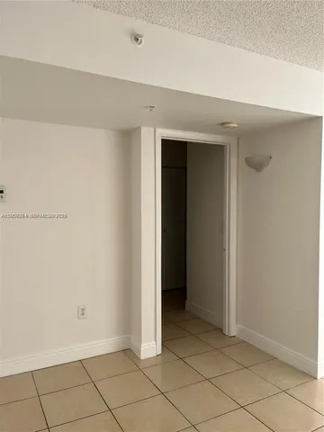 a kitchen with a stove a refrigerator and a sink