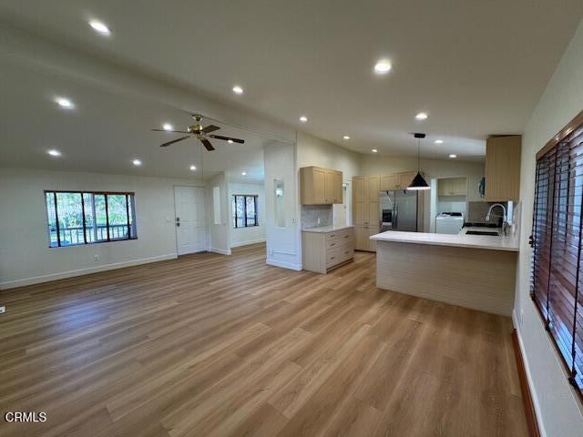 4061 Donlon Road Somis, CA 93066 - Photo 5 of 23 a large space with stainless steel appliances kitchen island wooden floor and living room view