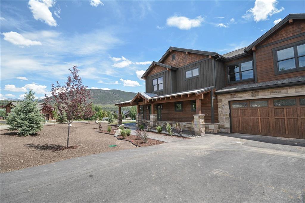 98 Landon Lane Dillon, CO 80435 - Photo 28 of 33 a view of a patio with table and chairs and potted plants