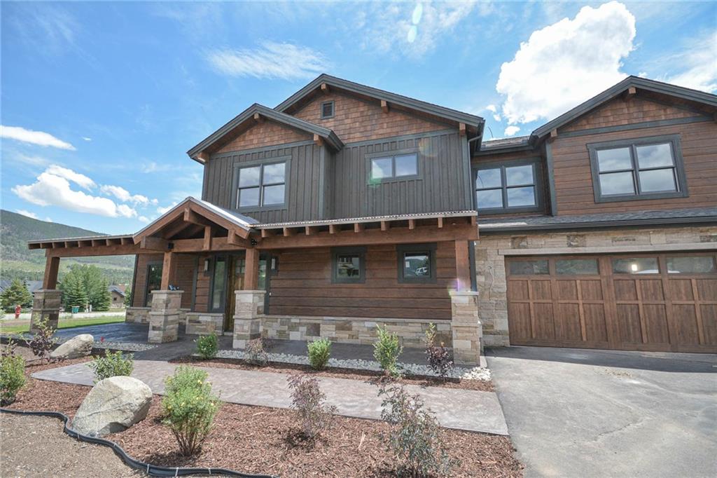 98 Landon Lane Dillon, CO 80435 - Photo 31 of 33 a front view of a house with a yard and garage