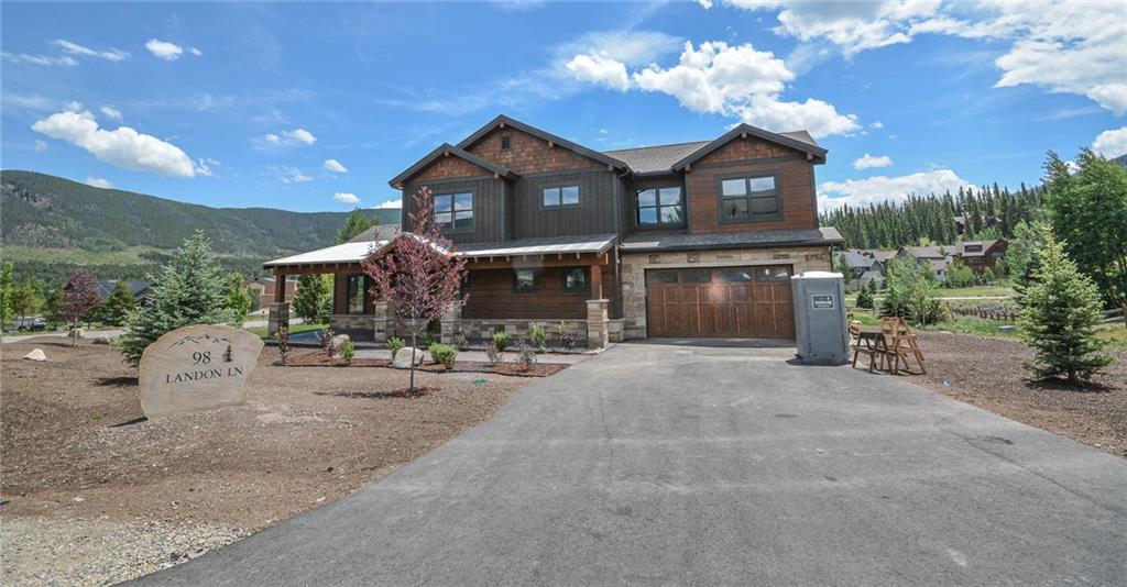 98 Landon Lane Dillon, CO 80435 - Photo 32 of 33 a front view of a house with a yard and garage