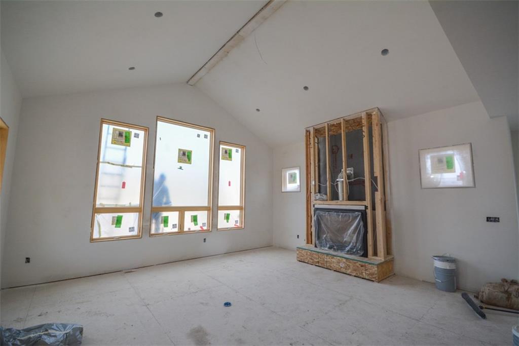 98 Landon Lane Dillon, CO 80435 - Photo 6 of 33 a view of an empty room with a window and a fireplace