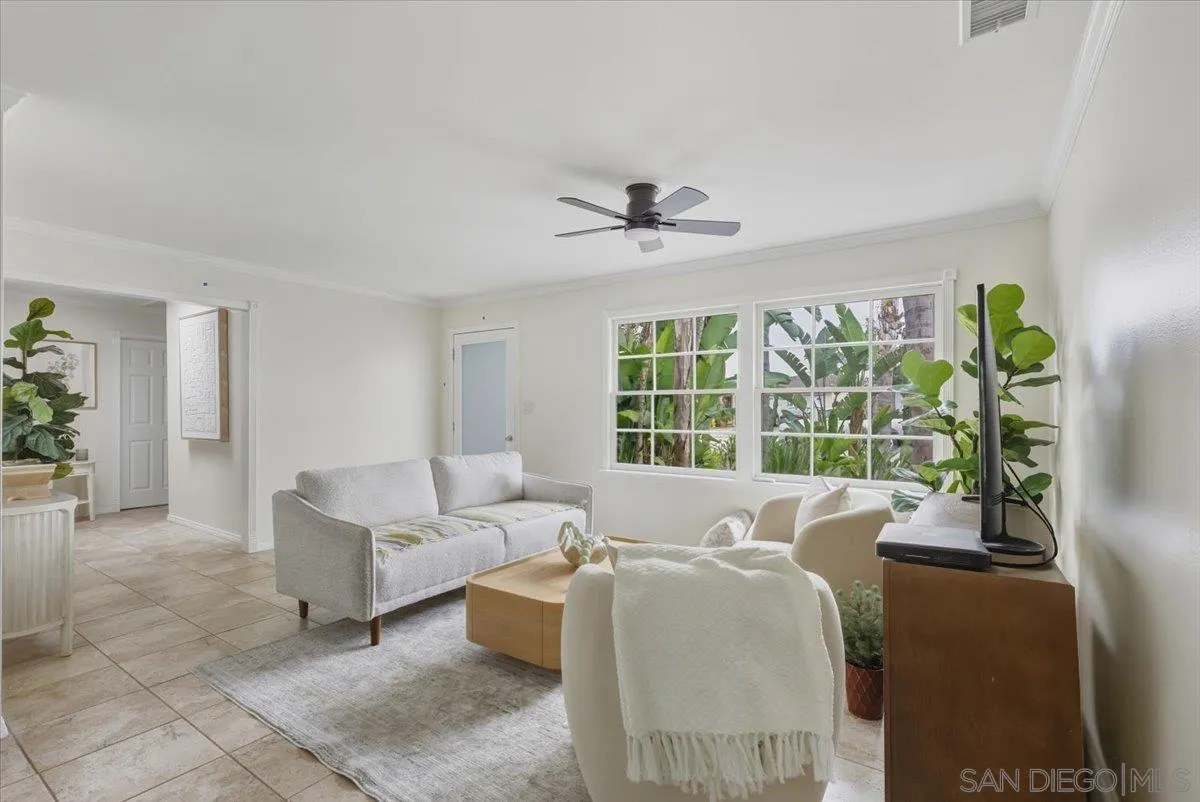 8888 Jaylee Avenue Spring Valley, CA 91977 - Photo 1 of 19 a living room with furniture and a large window