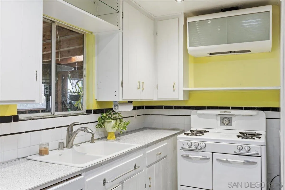 8888 Jaylee Avenue Spring Valley, CA 91977 - Photo 12 of 19 a kitchen with a sink and cabinets