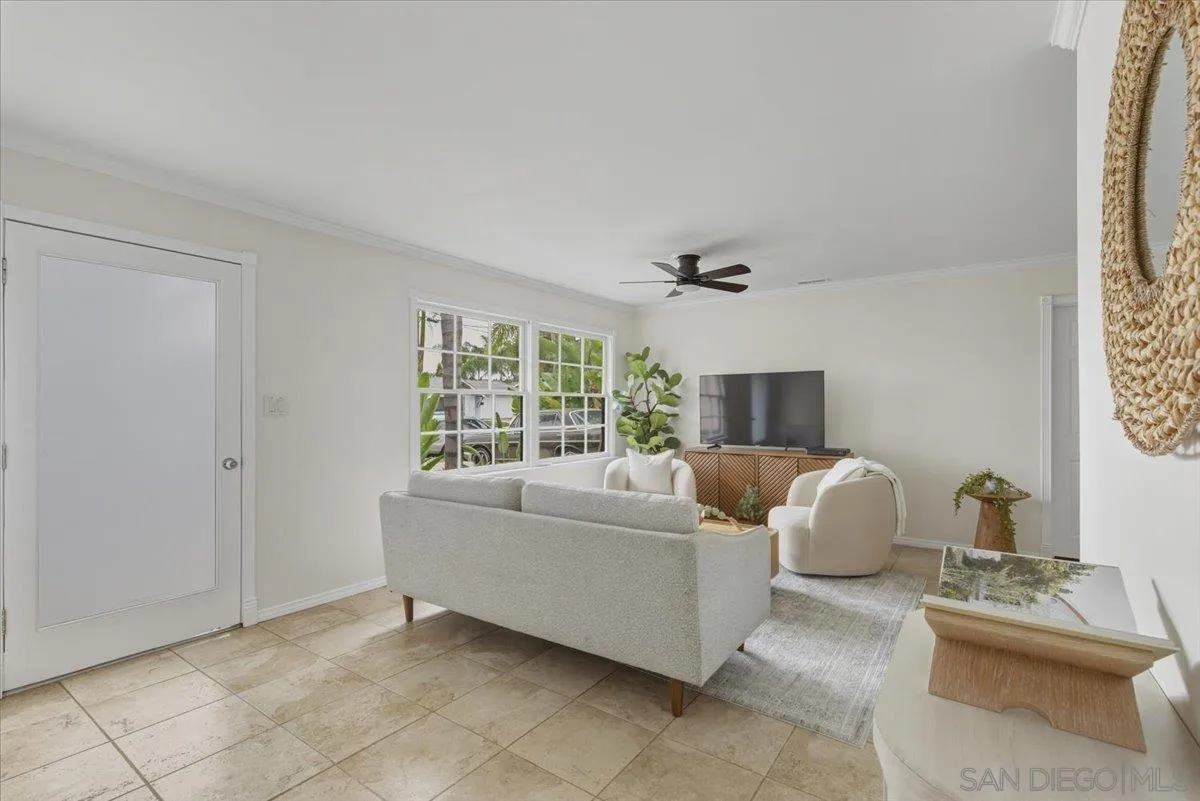 8888 Jaylee Avenue Spring Valley, CA 91977 - Photo 16 of 19 a living room with furniture and a flat screen tv