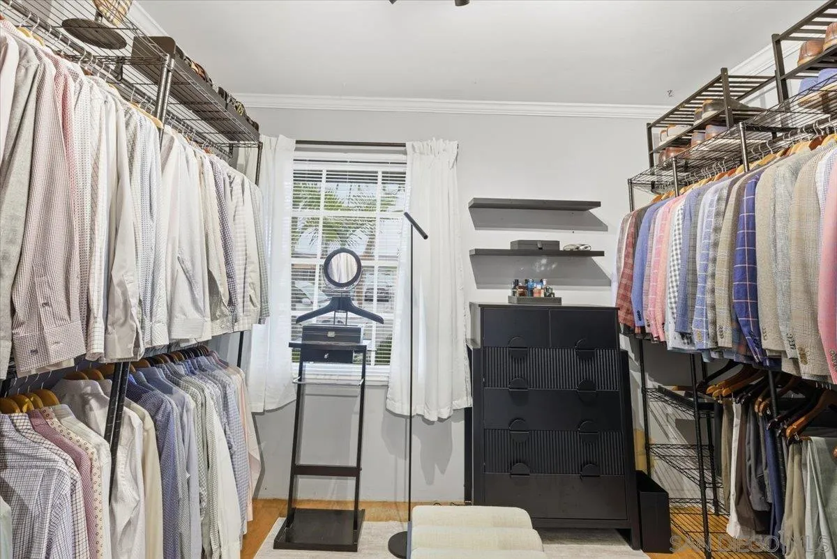 8888 Jaylee Avenue Spring Valley, CA 91977 - Photo 17 of 19 a view of walk in closet with clothes and shoes