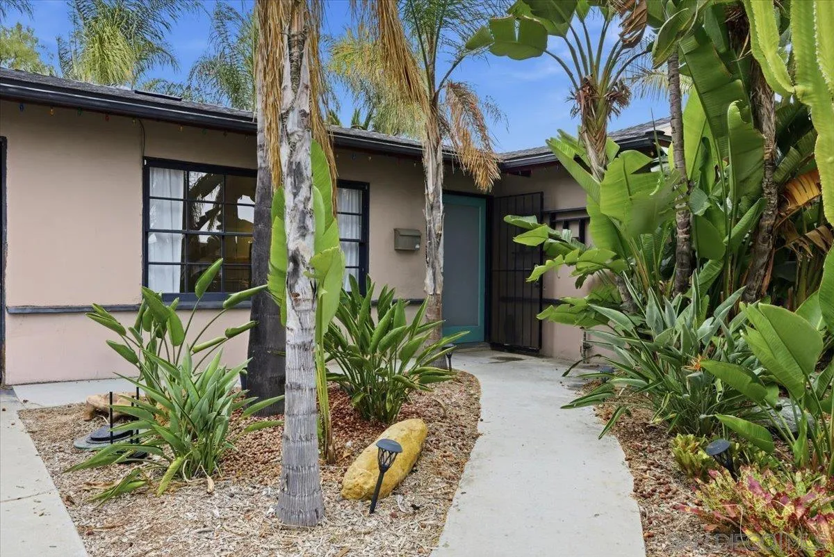 8888 Jaylee Avenue Spring Valley, CA 91977 - Photo 6 of 19 a potted plant is sitting in front of a house