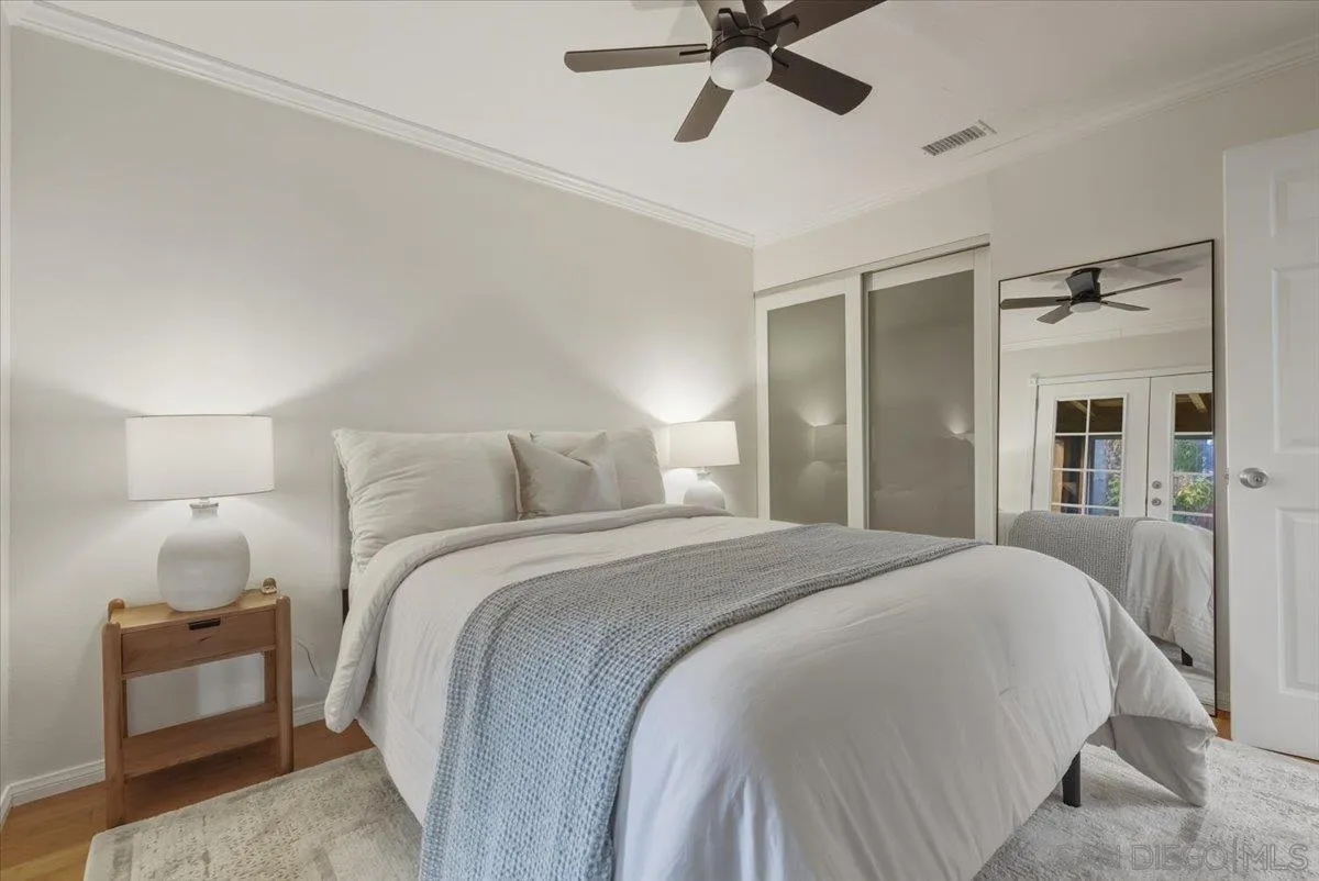 8888 Jaylee Avenue Spring Valley, CA 91977 - Photo 7 of 19 a bedroom with a bed and a chandelier