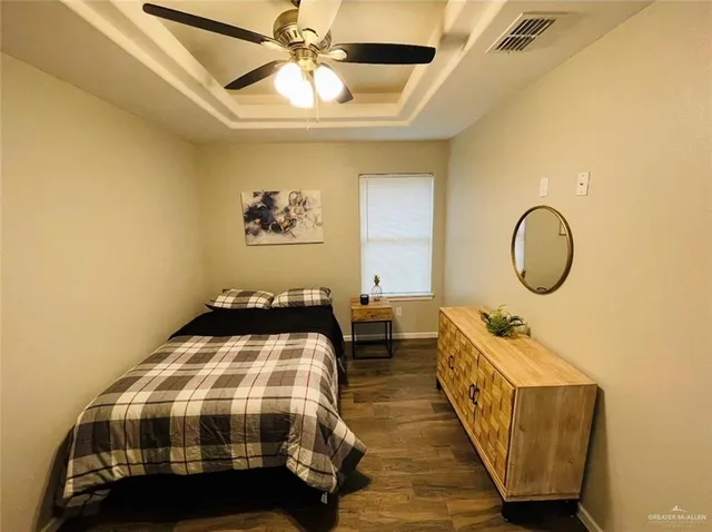 a bedroom with bed and a window