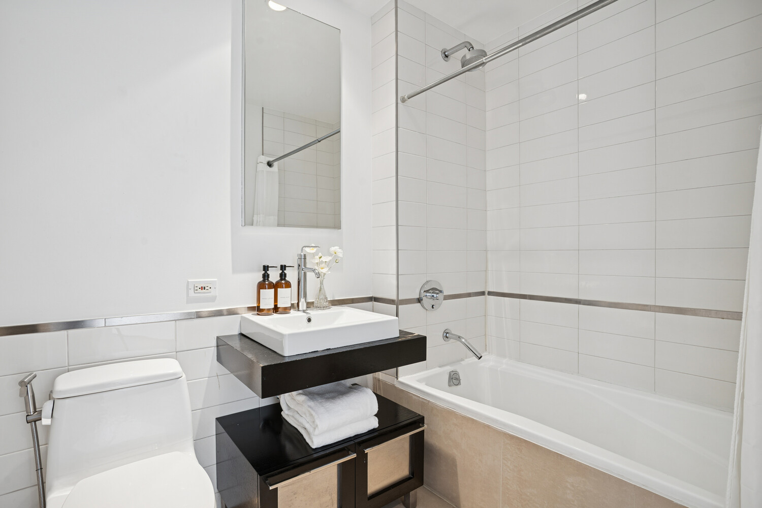 165 West 18th Street, Unit 3C Manhattan, NY 10011 - Photo 8 of 12 a bathroom with a sink a toilet and shower