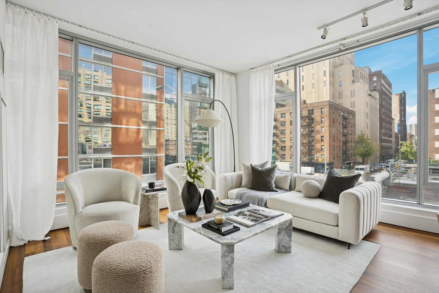 165 West 18th Street, Unit 3C Manhattan, NY 10011 - Photo 2 of 12 a living room with furniture and a large window
