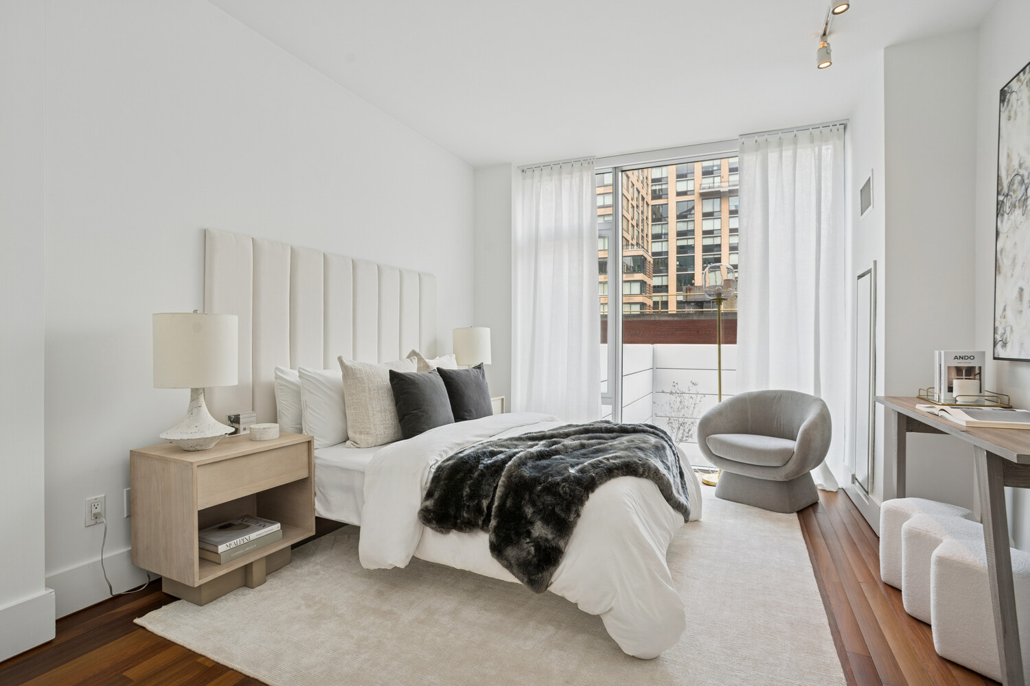 165 West 18th Street, Unit 3C Manhattan, NY 10011 - Photo 5 of 12 a bedroom with a bed and chair