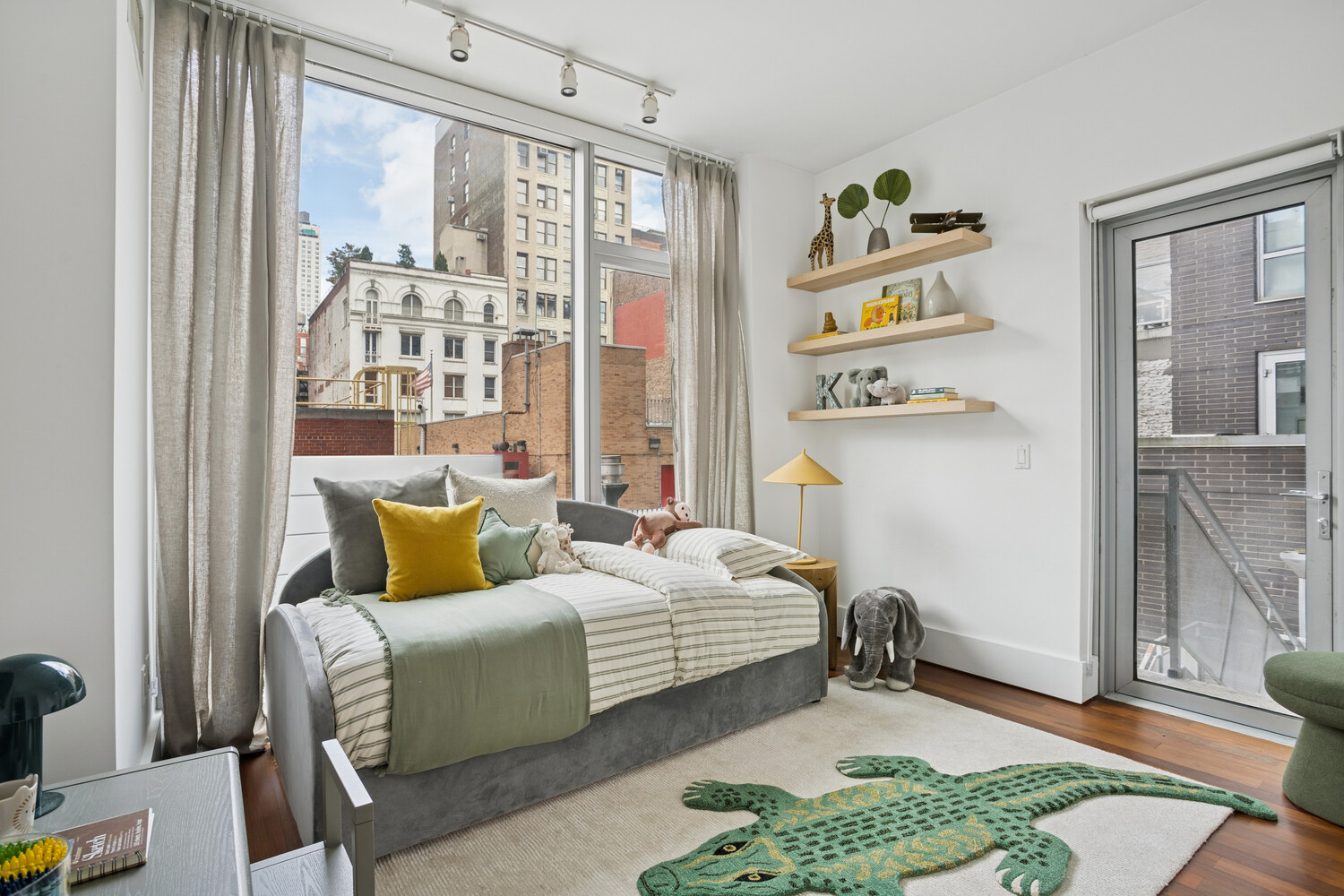 165 West 18th Street, Unit 3C Manhattan, NY 10011 - Photo 7 of 12 a bedroom with furniture and a window