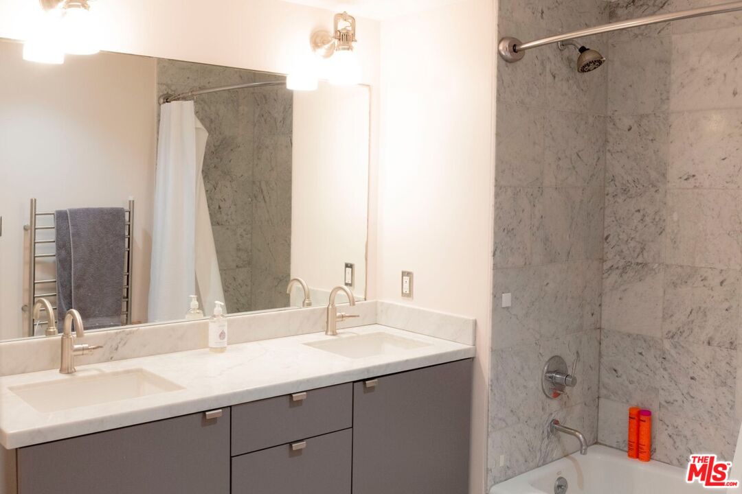 700 Main Street, Unit 12 Venice, CA 90291 - Photo 14 of 27 a bathroom with a sink and a mirror