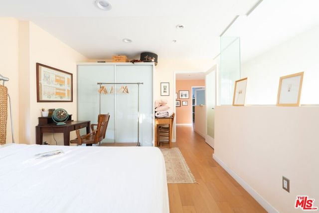 a bedroom with a bed and a table