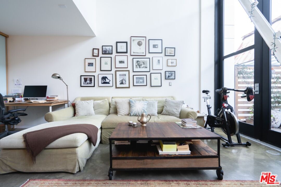 700 Main Street, Unit 12 Venice, CA 90291 - Photo 3 of 27 a living room with furniture and a flat screen tv