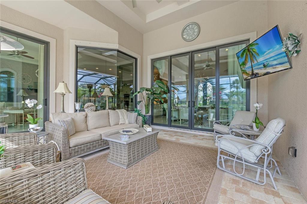 11920 Hedgestone Court Naples, FL 34120 - Photo 27 of 35 a living room with furniture and a large window