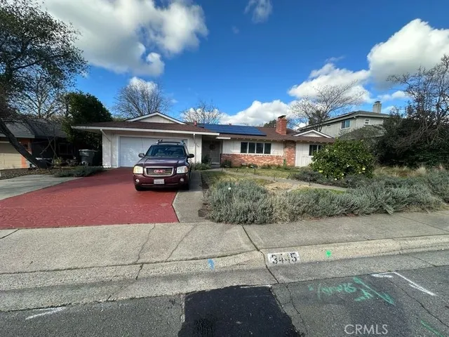 a car parked in front of a house