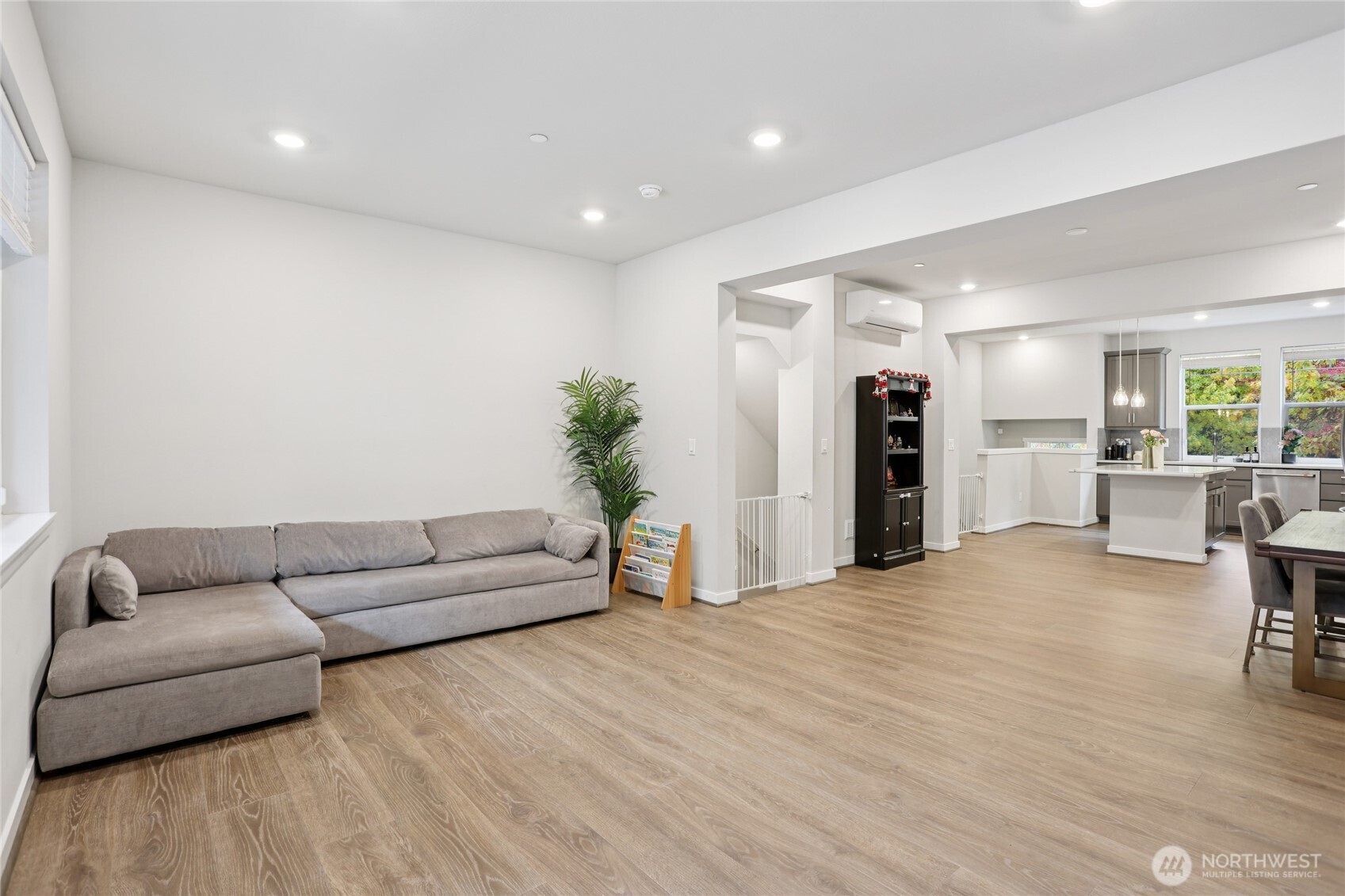 12006 Northeast 194th Drive, Unit E Bothell, WA 98011 - Photo 11 of 25 a living room with furniture and a wooden floor