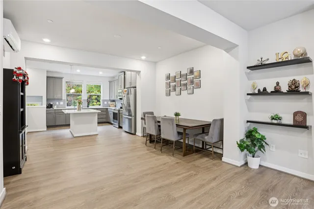 a view of a brick house with wooden floor and furniture