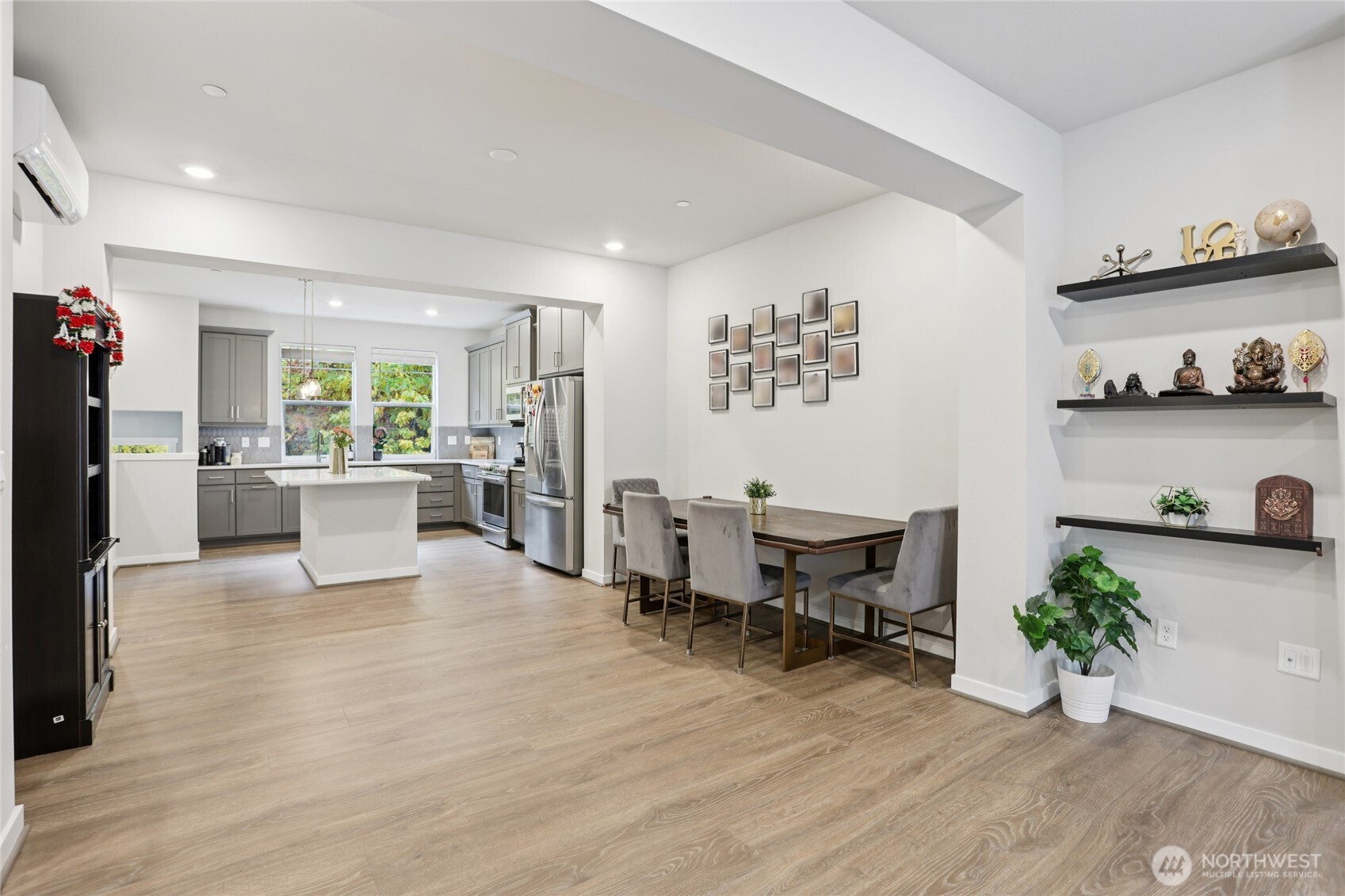 12006 Northeast 194th Drive, Unit E Bothell, WA 98011 - Photo 12 of 25 a living room with furniture and a wooden floor