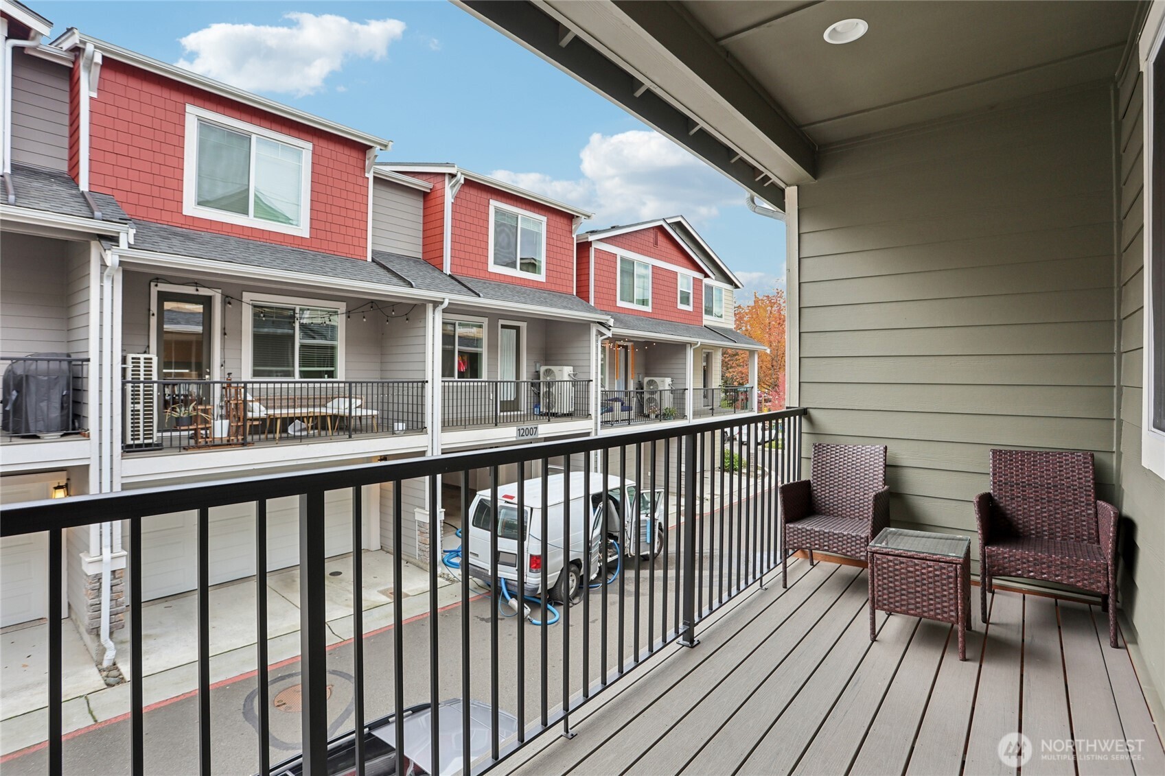 12006 Northeast 194th Drive, Unit E Bothell, WA 98011 - Photo 13 of 25 a view of a brick house with wooden floor and furniture