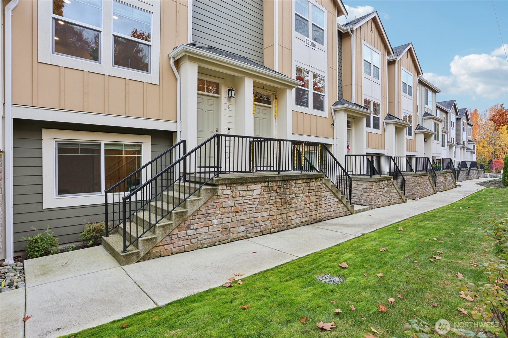 12006 Northeast 194th Drive, Unit E Bothell, WA 98011 - Photo 2 of 25 a view of a house with a yard