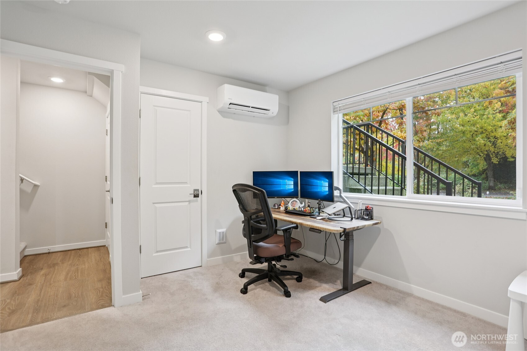 12006 Northeast 194th Drive, Unit E Bothell, WA 98011 - Photo 22 of 25 a view of a workspace with furniture and a window