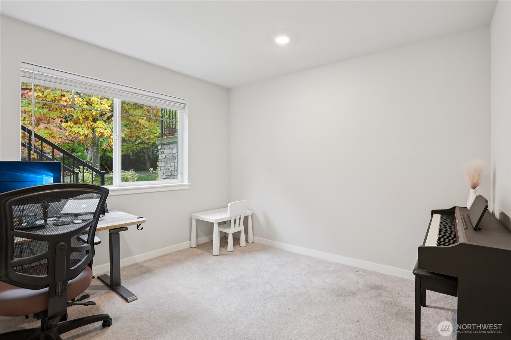 12006 Northeast 194th Drive, Unit E Bothell, WA 98011 - Photo 23 of 25 a view of a workspace with furniture and a window