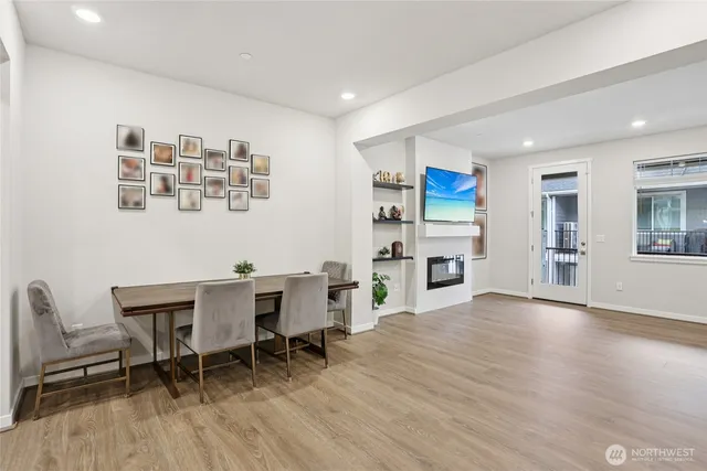 a view of livingroom with furniture fire place and refrigerator