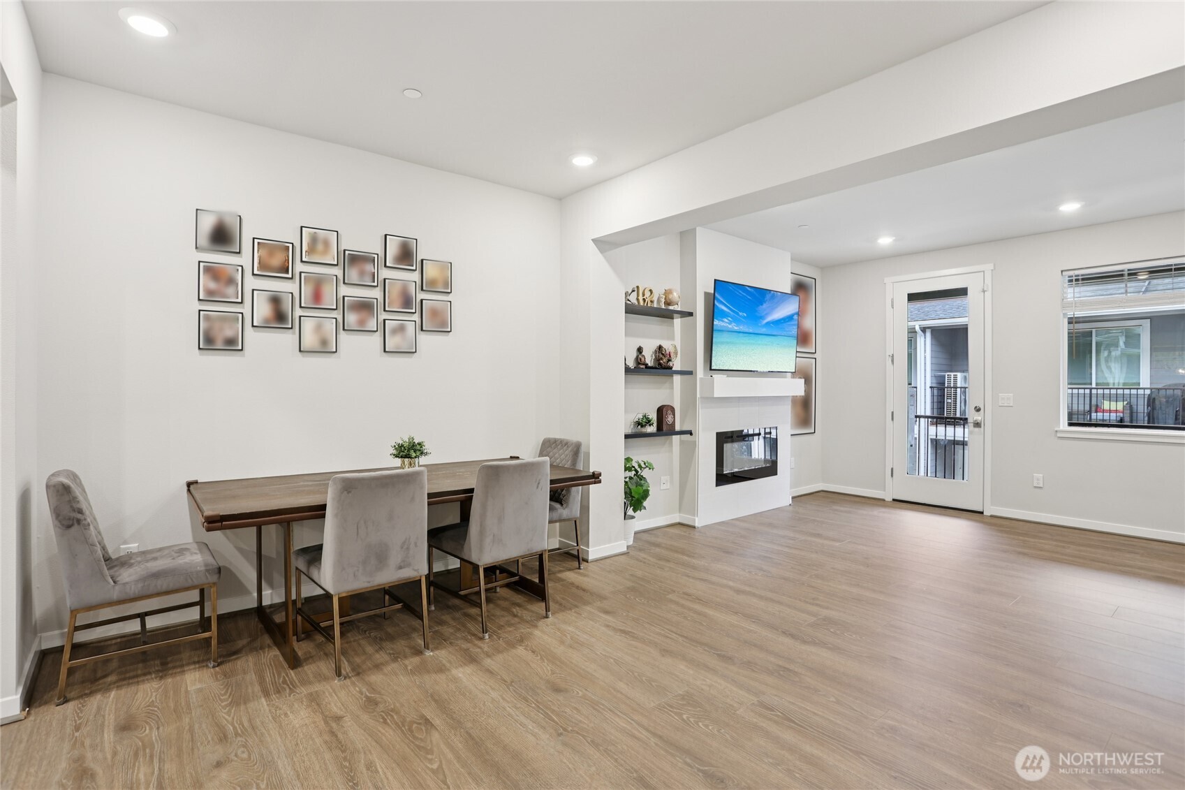 12006 Northeast 194th Drive, Unit E Bothell, WA 98011 - Photo 9 of 25 a view of a dining room with furniture wooden floor and a kitchen