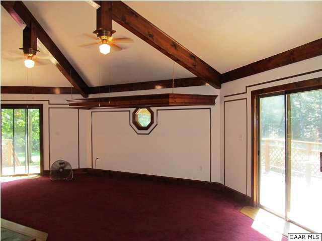 264 Creek Road Troy, VA 22974 - Photo 11 of 39 Family Room with sliding glass doors to full wrap around deck.