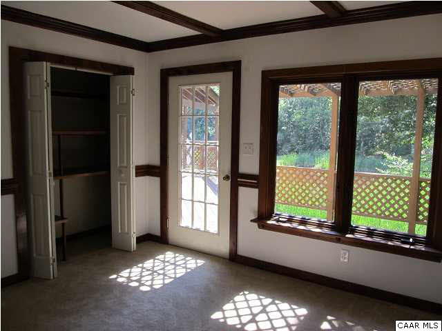 264 Creek Road Troy, VA 22974 - Photo 24 of 39 2nd bedroom with view to back deck & exterior door to back.
