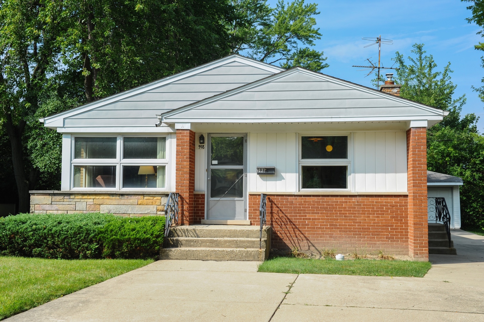 598 Sumac Road Highland Park, IL 60035 - Photo 1 of 10 a front view of a house with garage