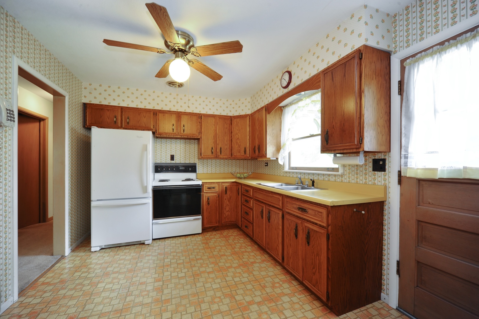 598 Sumac Road Highland Park, IL 60035 - Photo 4 of 10 a kitchen with a sink stove and refrigerator