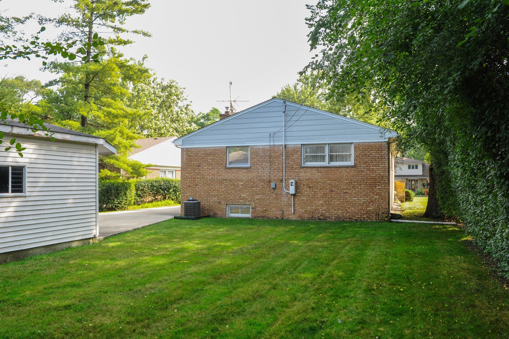 598 Sumac Road Highland Park, IL 60035 - Photo 9 of 10 a front view of a house with a yard and trees