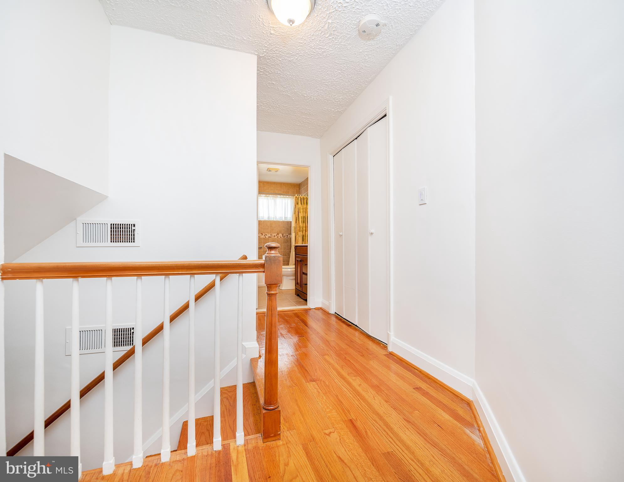 7860 Rockbourne Road Baltimore, MD 21222 - Photo 20 of 26 Hardwood Floors In Hallway