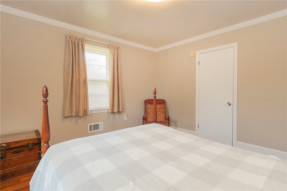 1218 Bolt Drive Anderson, SC 29621 - Photo 29 of 46 Natural light filters into this restful bedroom with crown molding and hardwood flooring.