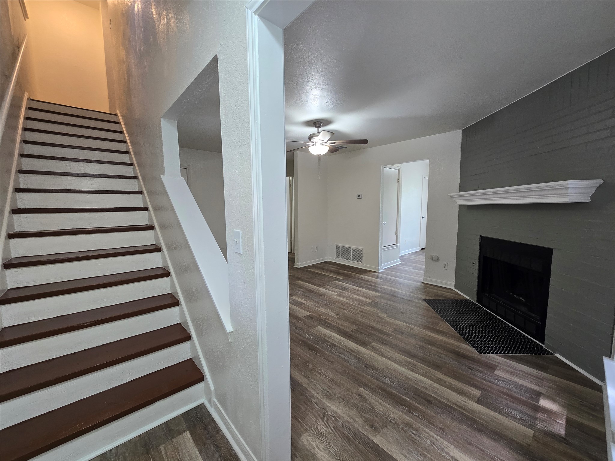 2003 Kenneth Avenue, Unit B Austin, TX 78741 - Photo 8 of 19 An inviting entry leads directly into a living area featuring a fireplace and modern flooring.