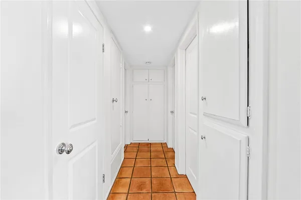 a bathroom with a shower and a mirror