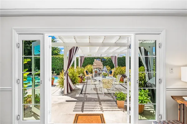 a view of a swimming pool with an outdoor seating