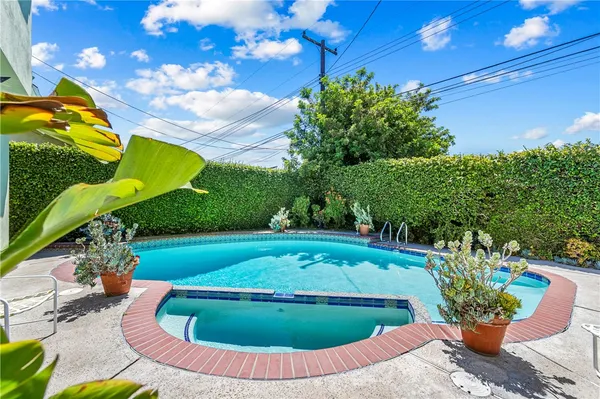 a view of a swimming pool with a patio