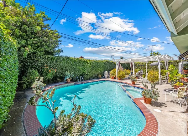 a view of a swimming pool with a patio