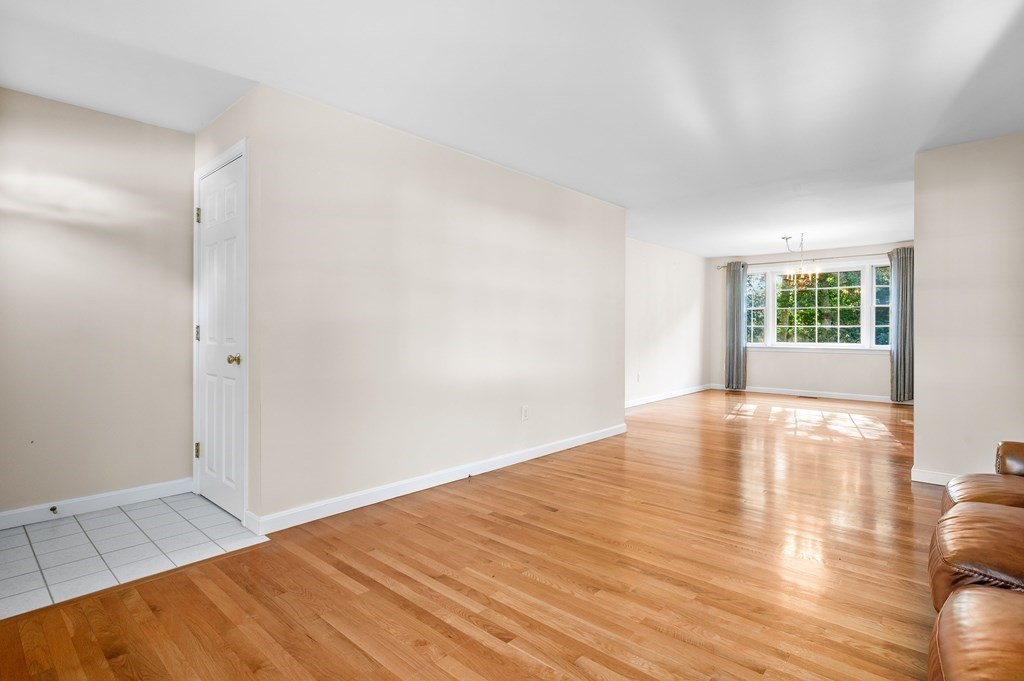 21 Micah Hamlin Road Centerville, MA 02632 - Photo 12 of 42 wooden floor in an empty room with a window