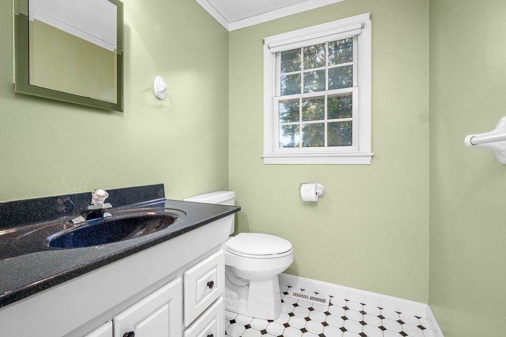 21 Micah Hamlin Road Centerville, MA 02632 - Photo 14 of 42 a bathroom with a sink a toilet and a window