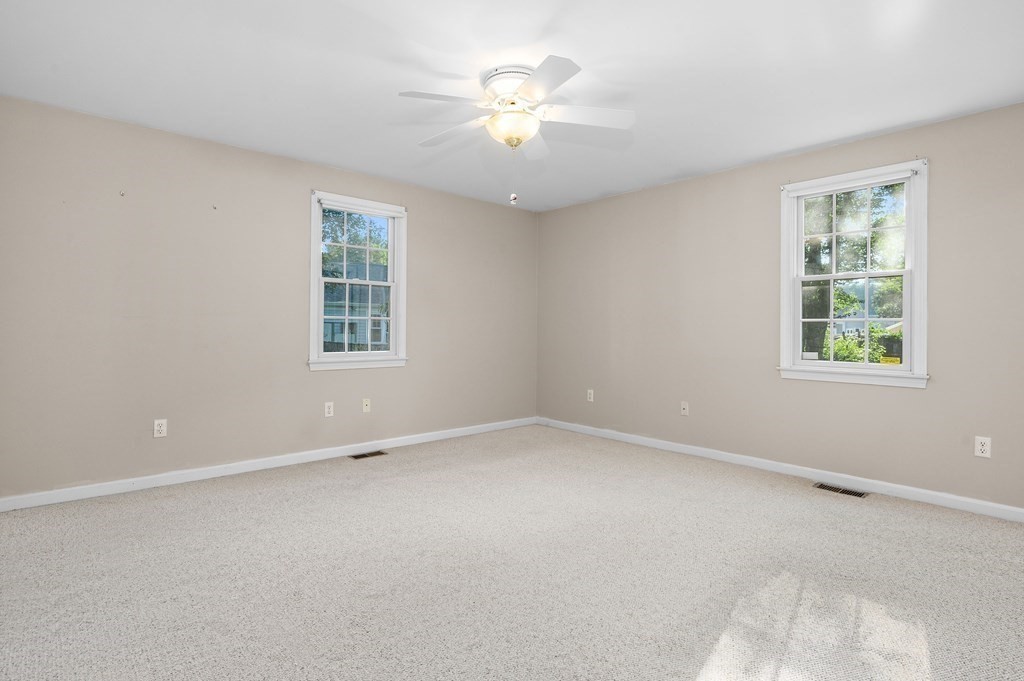 21 Micah Hamlin Road Centerville, MA 02632 - Photo 17 of 42 an empty room with a window and a ceiling fan
