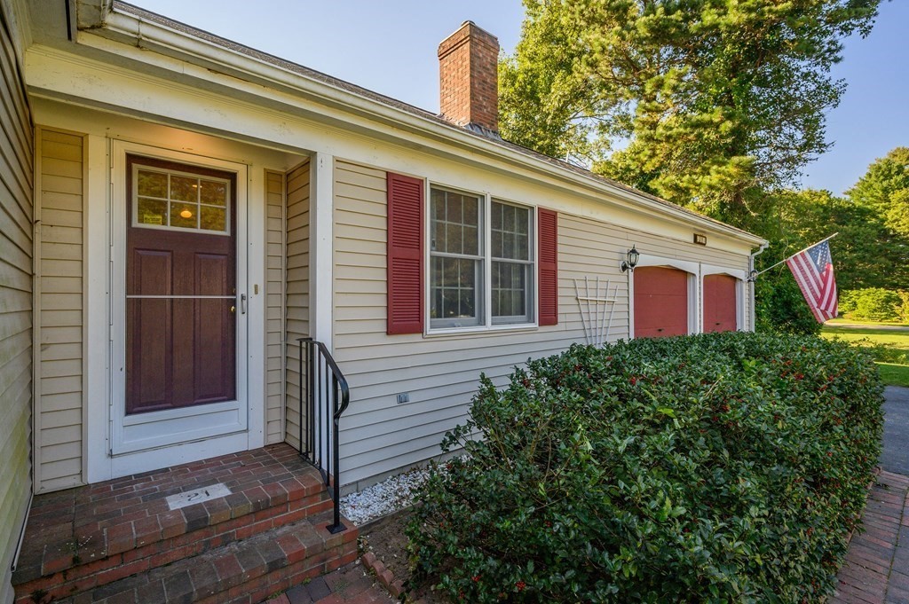 21 Micah Hamlin Road Centerville, MA 02632 - Photo 2 of 42 a view of a house with a large window and potted plants