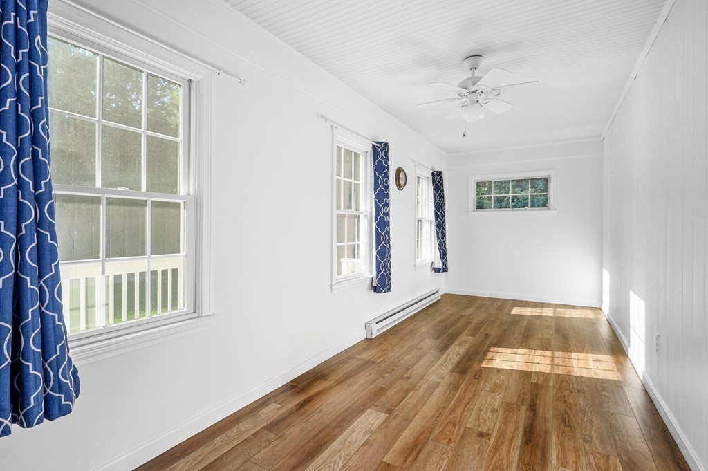 21 Micah Hamlin Road Centerville, MA 02632 - Photo 25 of 42 a view of an empty room with wooden floor and a window