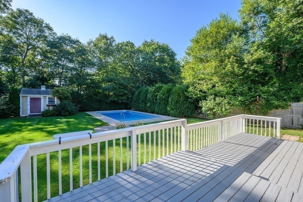 21 Micah Hamlin Road Centerville, MA 02632 - Photo 27 of 42 a view of a wooden deck with a yard
